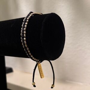 My Saint My Hero adjustable black and gold bracelet